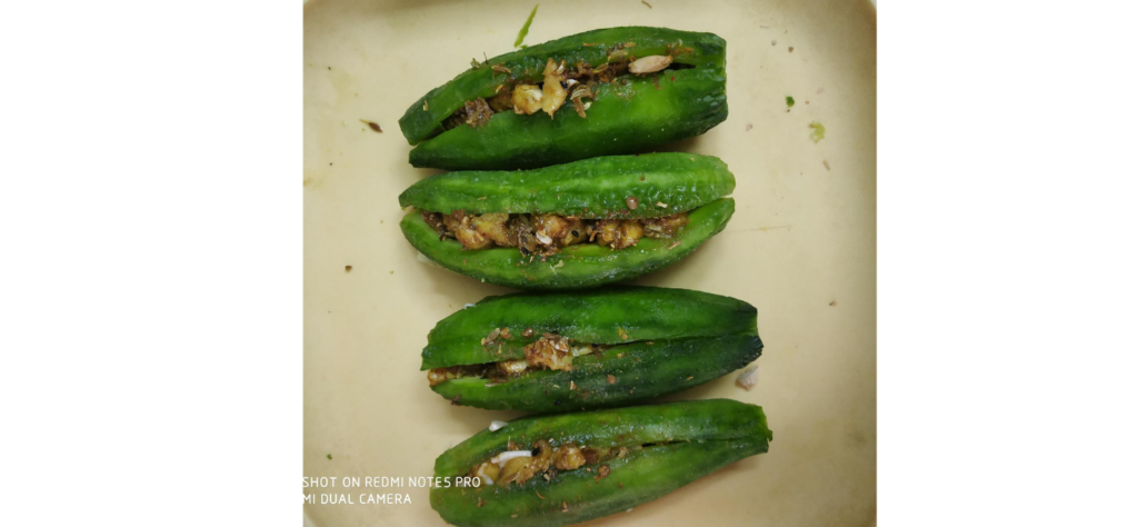 Seeds and spices in slit karela